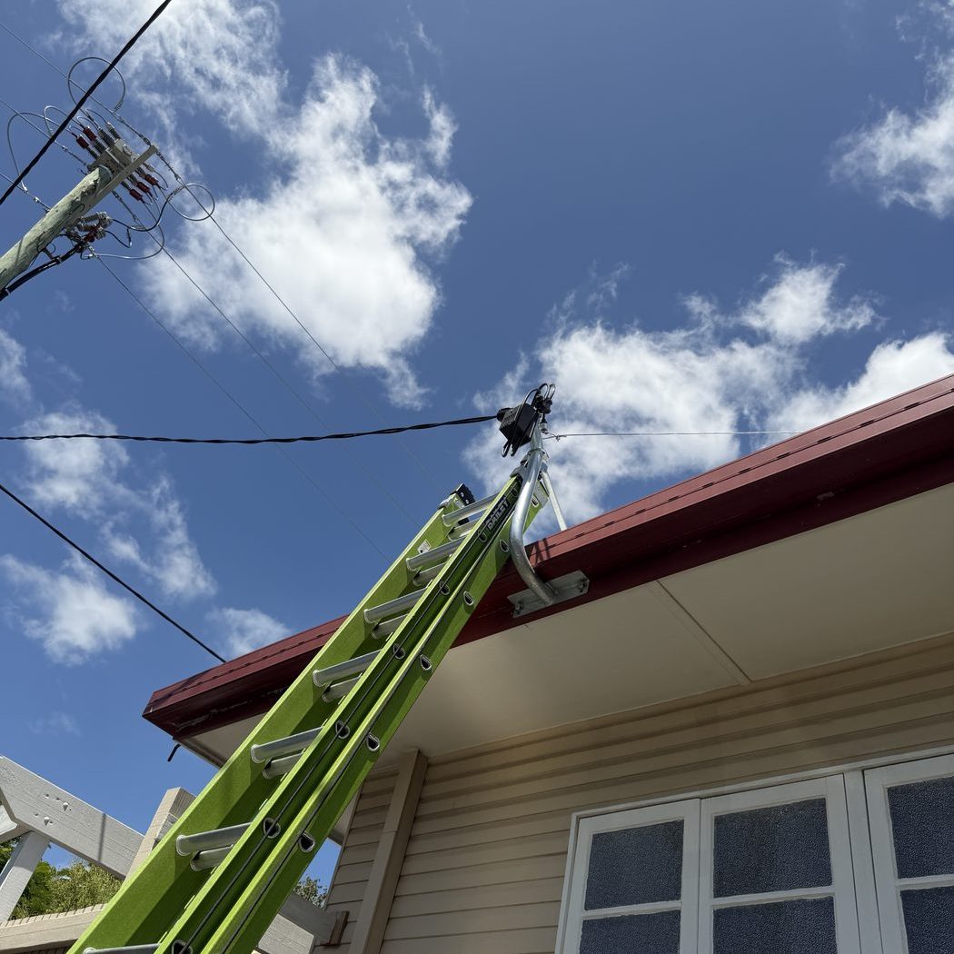 Ladder up to a classic Queensland home for electrical work — Ultralec Electrical servicing older homes across the Noosa Hinterland