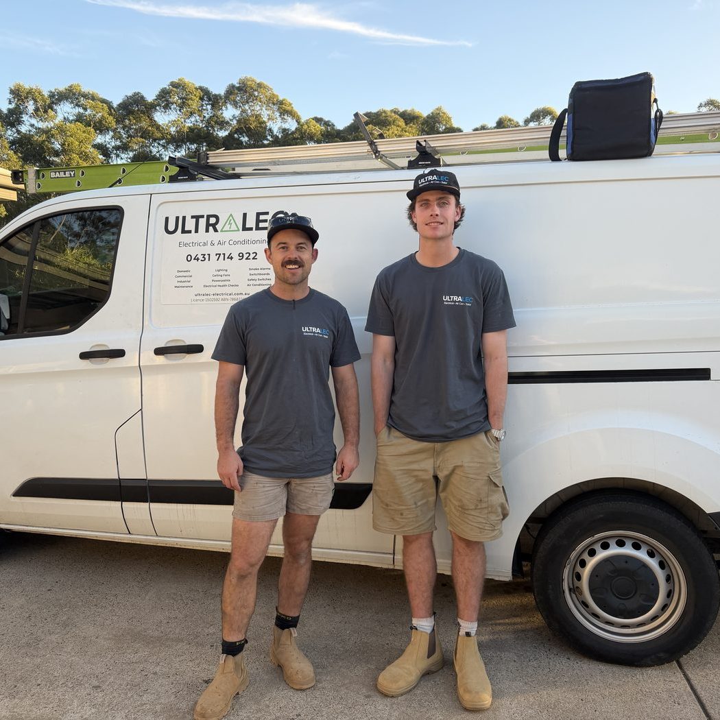 Alex and his apprentice from Ultralec Electrical in front of their branded van — local electricians serving Pomona and the Noosa Hinterland